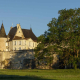 Le château de Montastruc, sa tour ronde et son rempart, au soleil du soir